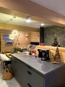 a kitchen with a christmas tree on a counter at OVIS HOMES APP in Zawoja