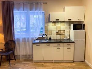 Kuchyňa alebo kuchynka v ubytovaní Mokka Apartament