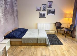 Posteľ alebo postele v izbe v ubytovaní Mokka Apartament