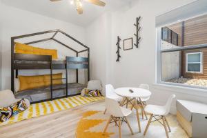 a room with a bunk bed and a table and chairs at Legacy Lakeside Retreat in Kimberling City +90 photos