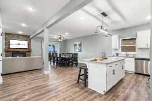 an open kitchen and living room with a dining room at Near Indoor & Outdoor Pools: Hot Tub, Game Room & Free SDC Tickets in Kimberling City