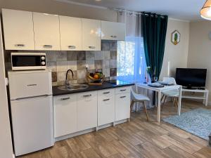 Kuchyňa alebo kuchynka v ubytovaní Mokka Apartament