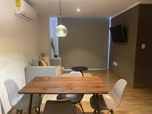 TV a/nebo společenská místnost v ubytování Modernos departamentos tipo LOFT a dos calles del estadio