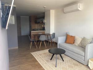 Posezení v ubytování Modernos departamentos tipo LOFT a dos calles del estadio