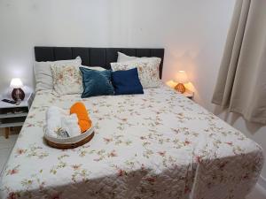 a bed with two stuffed animals in a basket on it at #PARADISE SUITES - TATUAPÉ in Sao Paulo