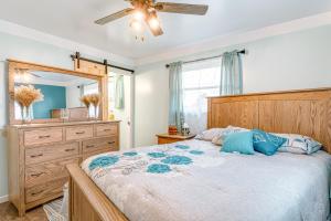 a bedroom with a large bed and a mirror at Cozy Richmond Home with Fire Pit Walk, Bike and More! in Richmond