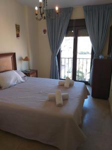 Ένα ή περισσότερα κρεβάτια σε δωμάτιο στο EL MIRADOR DE LA DUQUESA