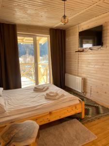 Postel nebo postele na pokoji v ubytování Chalet Ivanna