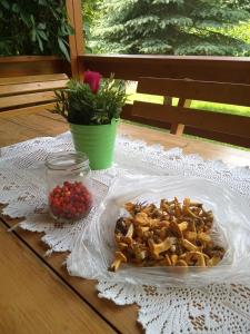 a plate of food on a table with a plate of food at Enklawa Spokoju in Słójka Borowszczyzna +22 photos
