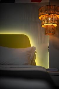 Cama o camas de una habitación en Bossa Jurerê Hotel