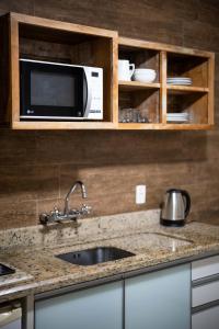 Una cocina o zona de cocina en Bossa Jurerê Hotel