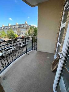 a balcony of a building with a bench on it at Entire 1 bed apartment-Convenient and peaceful amenable stay in London