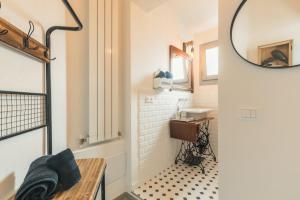 a bathroom with a sink and a mirror at B&B Antico Telaio in Santa Maria Navarrese