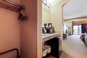 a hotel room with a sink and a microwave at Chula Vista Condo 2341 in Wisconsin Dells