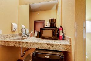 a kitchen counter with a sink and a microwave at Chula Vista Condo 2341 in Wisconsin Dells +18 photos