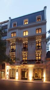 a large white building with lights in front of it at Algodon Mansion in Buenos Aires