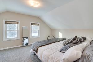 A bed or beds in a room at Charming Crookston Home Walk to Downtown!