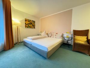 Postel nebo postele na pokoji v ubytování Hotel Bremer