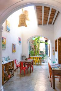 an archway in a restaurant with tables and chairs at Casa Tunido in Santa Marta