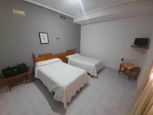 Lova arba lovos apgyvendinimo įstaigoje Hotel Restaurante Peñarroya