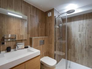 a bathroom with a shower and a toilet and a sink at Appartement Courchevel 1650, 5 pièces, 8 personnes - FR-1-563-136 in Courchevel