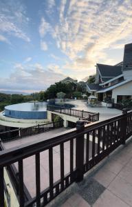 a resort with a swimming pool and a fence at H 109, Alta Vista De Boracay in Boracay