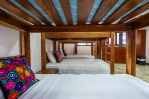 Postel nebo postele na pokoji v ubytování Itza Hotel Akumal