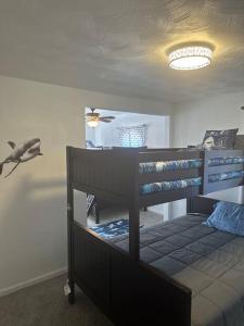 a bedroom with two bunk beds and a ceiling at Ocean Haus in Portsmouth