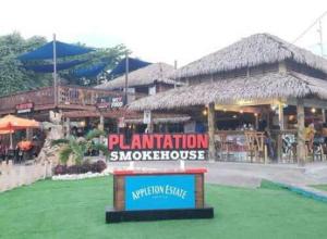 a building with a sign in front of it at Hill View Villas in Bamboo