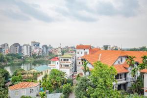 a view of a city with a river and buildings at La Passion - Tay Ho Hanoi One Bedroom Apartment! in Hanoi