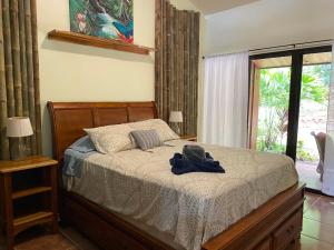 A bed or beds in a room at Toucan Valley Resort at Osa Mountain Village