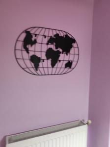 a pink world sign on a wall in a room at Artemis in Thessaloniki
