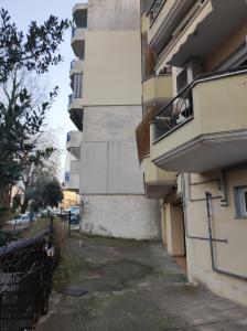 an apartment building with a balcony and a fence at Artemis in Thessaloniki