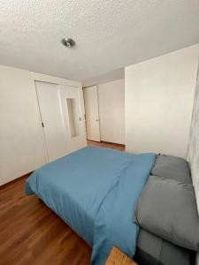 Una cama o camas en una habitación de Acogedor departamento El Vergel