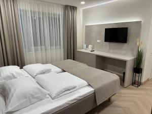 מיטה או מיטות בחדר ב-Žilina
