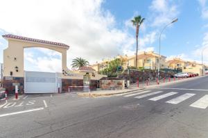 an empty street in front of a building with a parking lot at Ponderosa II in Sonnenland