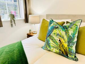 a bed with a pillow with bananas on it at Cowpasture Apt - Ilkley Central in Ilkley