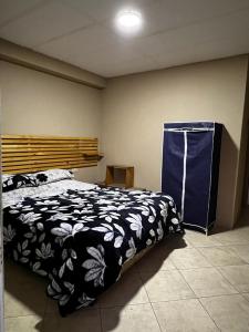 Un pat sau paturi într-o cameră la Hotel Gran Riviera
