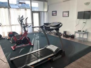 a gym with two exercise bikes and a treadmill at ubicacion perfecta en punta in Punta del Este