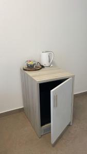 a small table with a cup on top of it at *Veranda's rooms* - Free parking in central Lugano in Lugano
