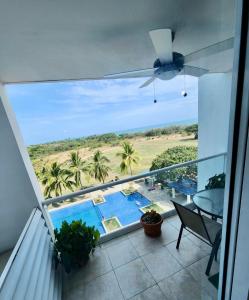 a balcony with a view of a swimming pool at PlayaBlanca Ocean Blue "Vista al Mar" in Playa Blanca