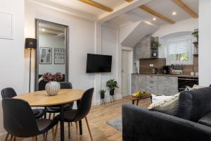 a living room with a table and a couch at Nono's House I in Dubrovnik