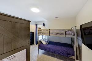 a room with two bunk beds and a closet at Lake Ozark Vista in Lake Ozark