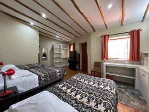 Postel nebo postele na pokoji v ubytování Anka Wasi Lodging