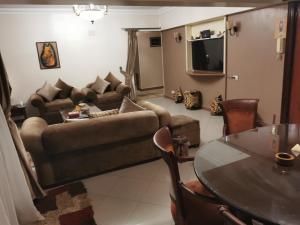 a living room with a couch and a table at Adham's Inn in Cairo