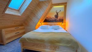 Posteľ alebo postele v izbe v ubytovaní Apartament Podwika
