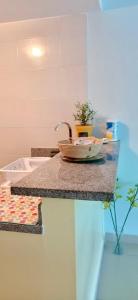a counter top with a bowl on top of it at PlayaBlanca Ocean Blue "Vista al Mar" in Playa Blanca
