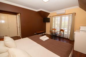 Cama ou camas em um quarto em Hotel Inti Kuyen Plaza