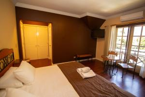 Cama ou camas em um quarto em Hotel Inti Kuyen Plaza