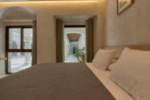 Casa Quiote Hotel Boutique City Center based - Adults Only tesisinde bir odada yatak veya yataklar